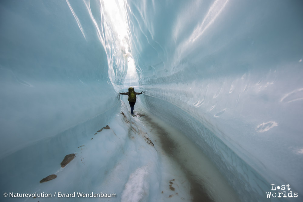 Walking through a glacier rill that closes up like a tunnel on the Edward Bailey glacier.